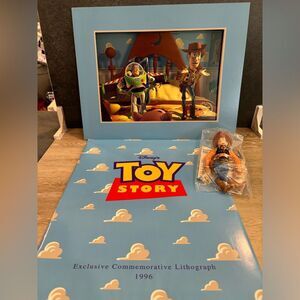 1996 Toy Story Lithograph with new 6”Woody doll from Burger King